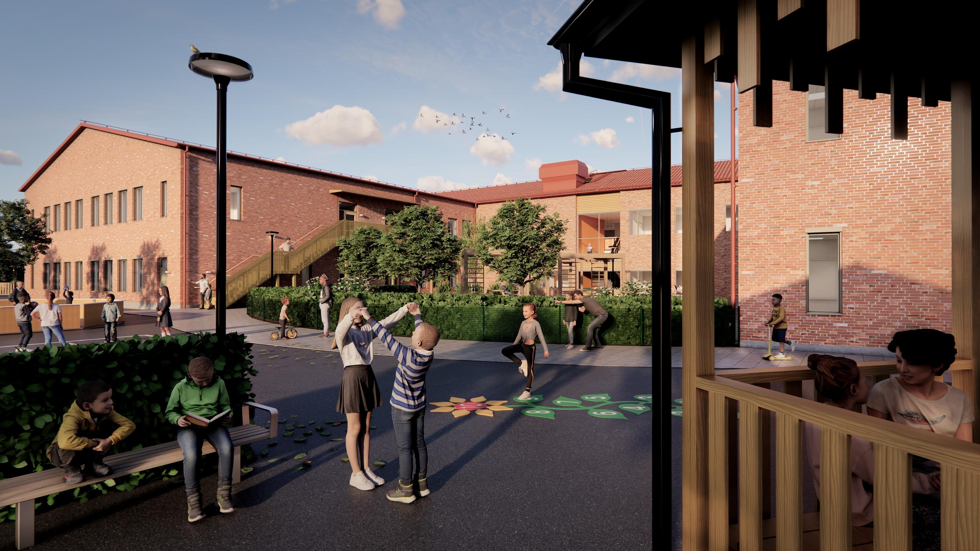 Skolgård med en röd tegelbyggnad i två våningar i bakgrunden
